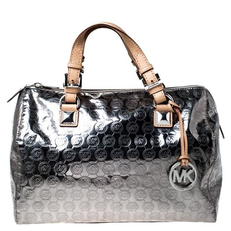 michael kors silver handbag|michael kors large wristlet clutch.